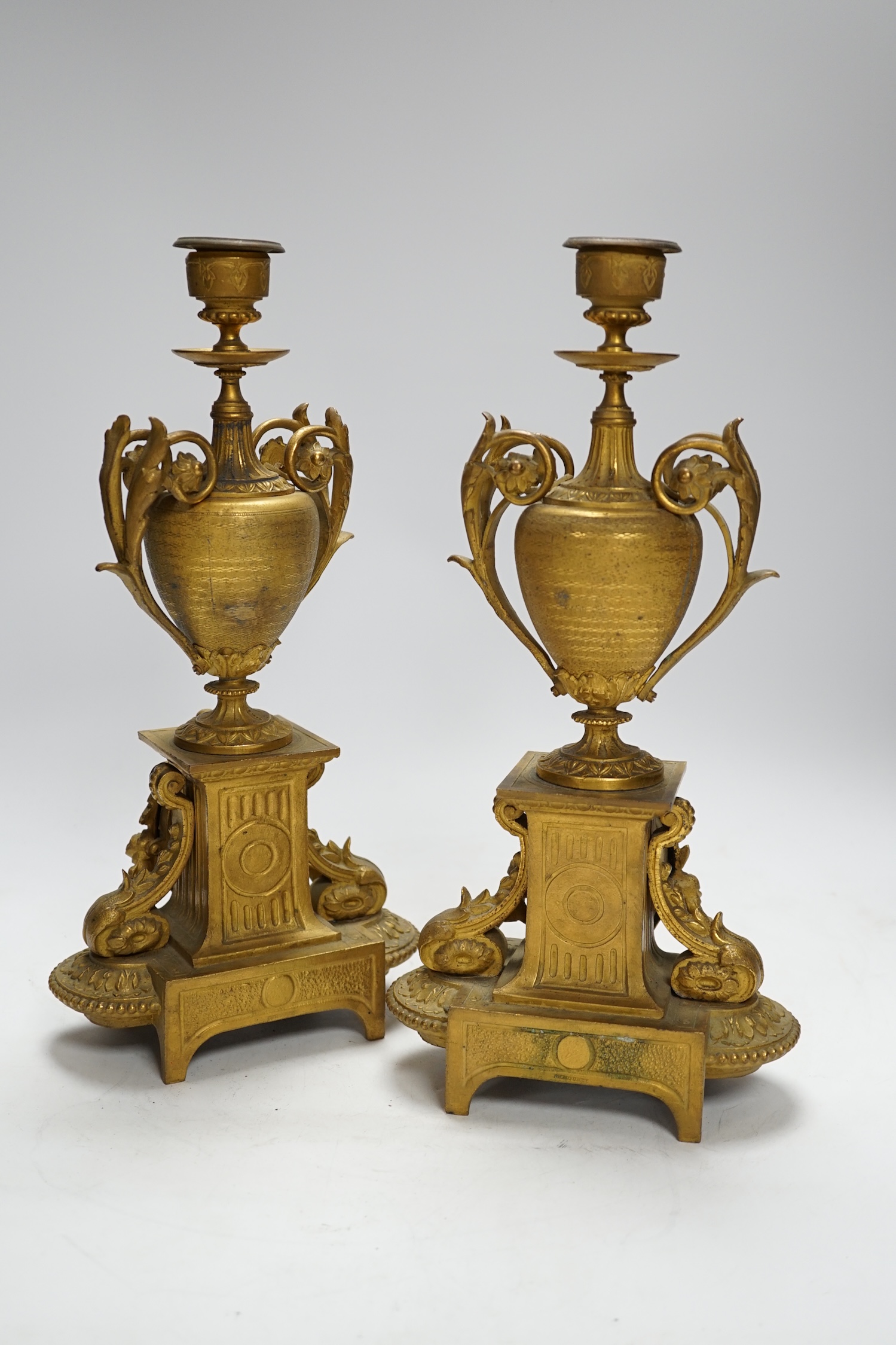 A pair of 19th century French ornamental gilt metal candlesticks, possibly clock garnitures, 32.5cm high